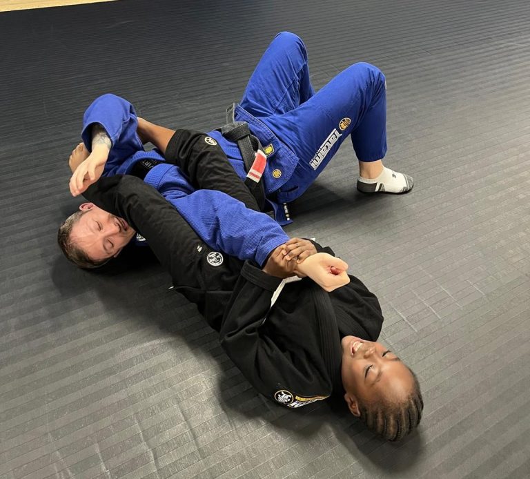 Mike Buckman-Cowling getting armlocked by one of the students from the Junior class.