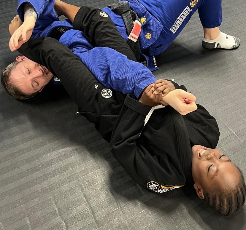 Mike Buckman-Cowling getting armlocked by one of the students from the Junior class.